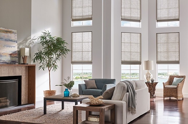 Natural Shade Roman Living — Introduce a natural touch to your living room blinds through organic materials, colors, and textures.